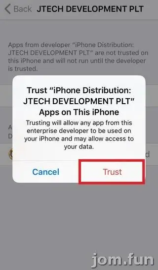 Pop-up asking to trust iPhone Distribution: JTECH DEVELOPMENT PLT apps on this iPhone, with Cancel and a red-outlined Trust button