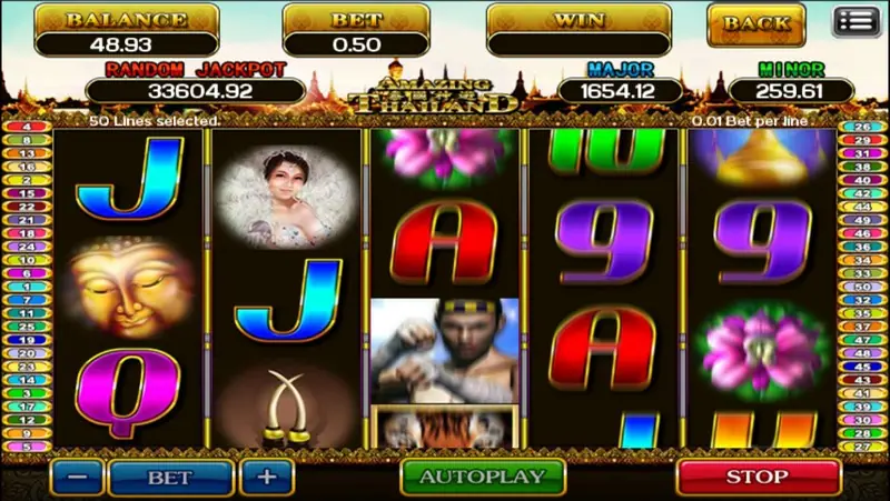 Reels mid-spin with the Muay Thai fighter on reel 3, a gold Buddha face on reel 1 and the red STOP button lit