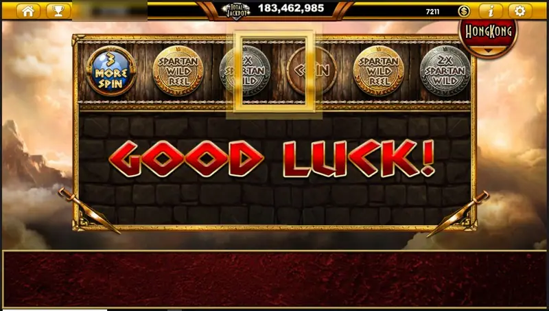 Sparta Legacy shield reel sliding, with GOOD LUCK in red on a stone wall and a gold frame over the middle shield
