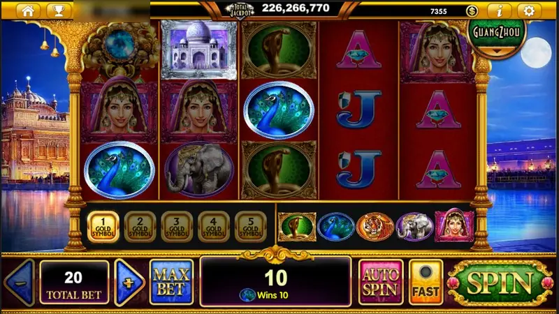The TAJ Majestic win of 10 at total bet 20, with two portrait symbols and peacocks on the left reels and a Taj Mahal tile on reel two