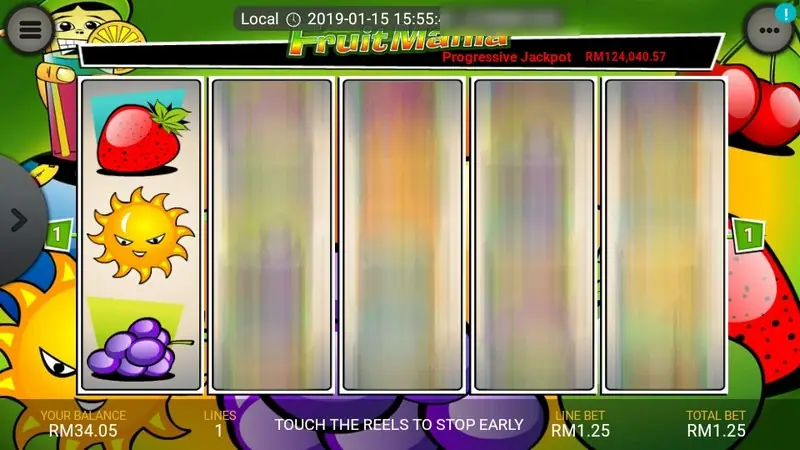 Fruit Mania reels mid-spin with the left reel stopped on a strawberry, sun and grapes and the others blurred