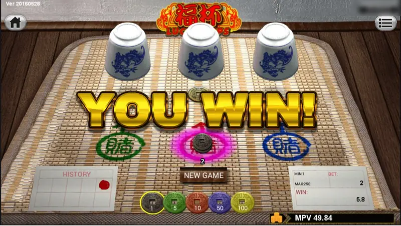 Lucky Cups result: cups lifted, a coin under the middle one, YOU WIN, the red spot lit with 2 on it, win 5.8, NEW GAME button