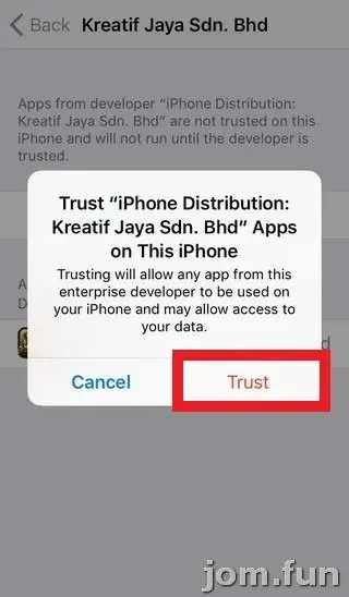 Confirmation pop-up asking to trust iPhone Distribution: Kreatif Jaya Sdn. Bhd apps on this iPhone, with Trust outlined in red